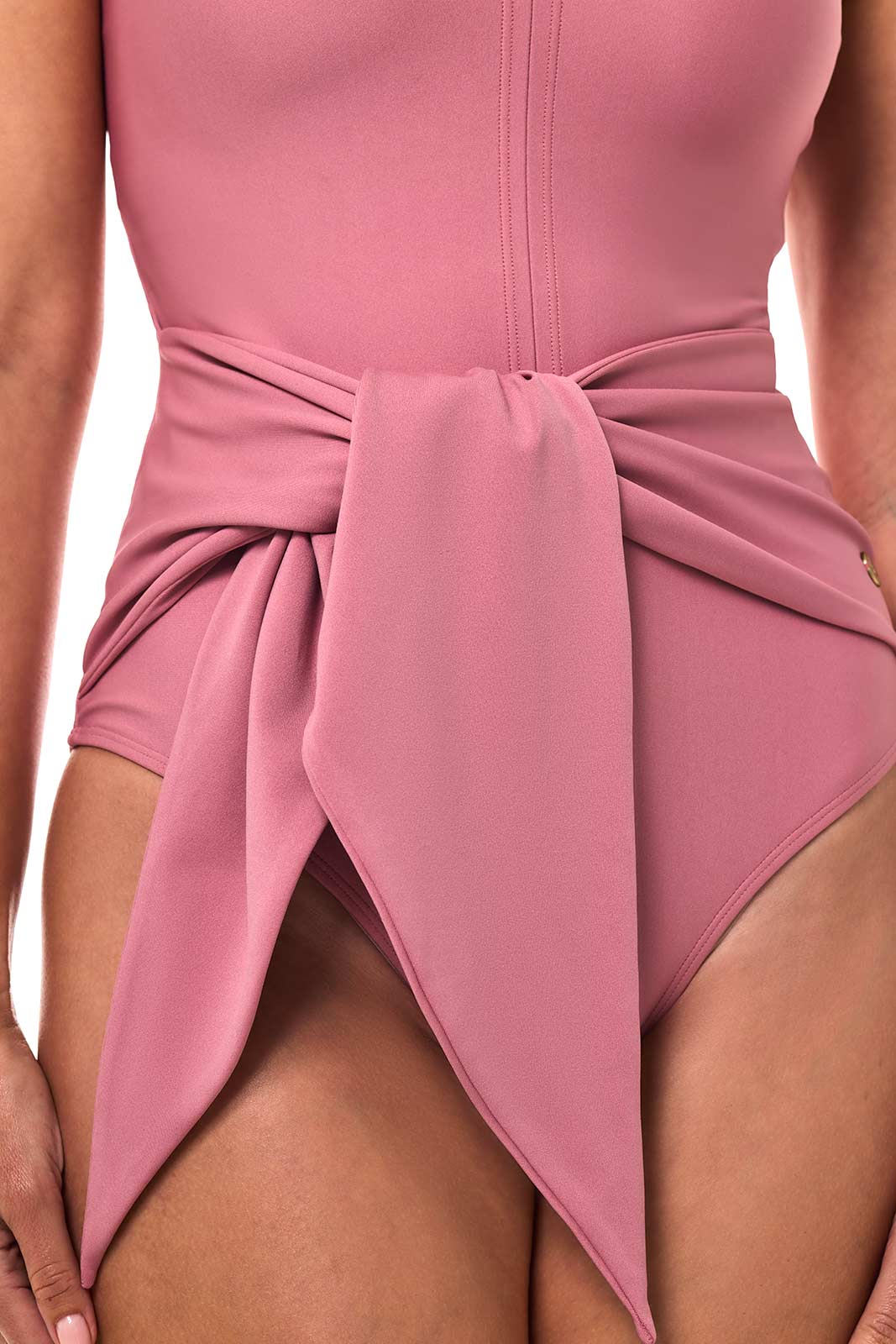 Pink dress with a bow detail on a blurred background