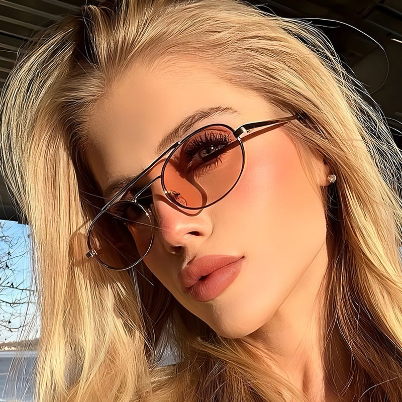 Woman wearing sunglasses with a blurred outdoor background