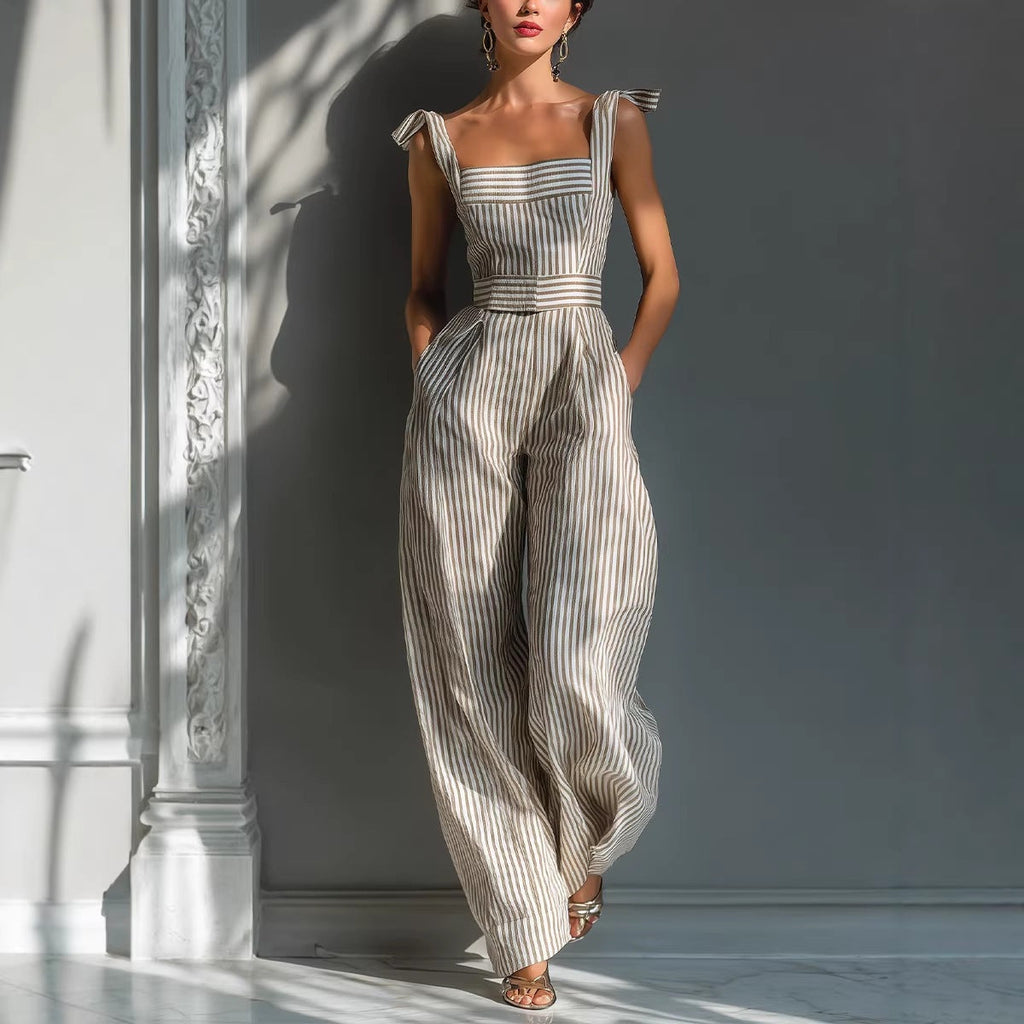 Woman wearing a striped dress with bow straps against a neutral background