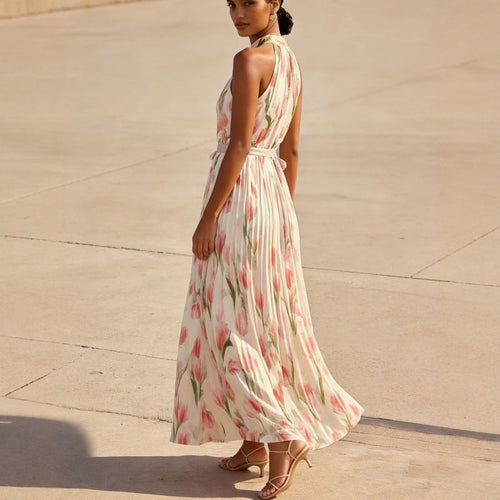 Woman wearing a floral dress standing on a concrete surface