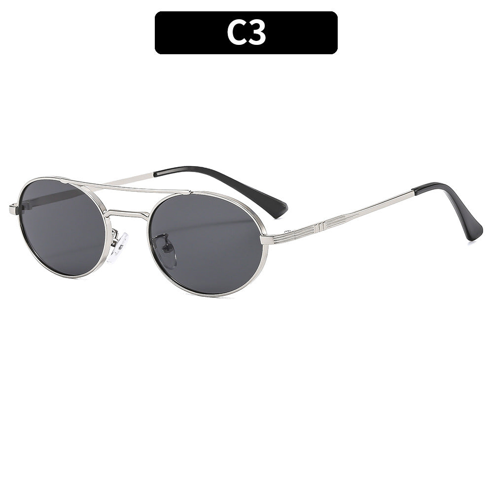 Round sunglasses with metallic frame and dark lenses on a white background