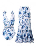 Navy Blue and white floral swimsuit and skirt set on a white background