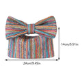 Colorful knitted bow tie clutch with measurements on a white background
