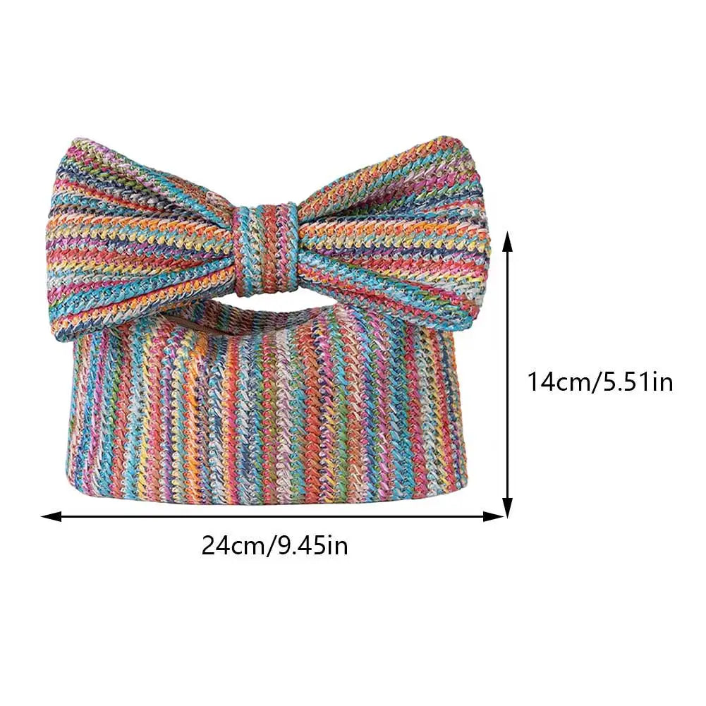 Colorful knitted bow tie clutch with measurements on a white background