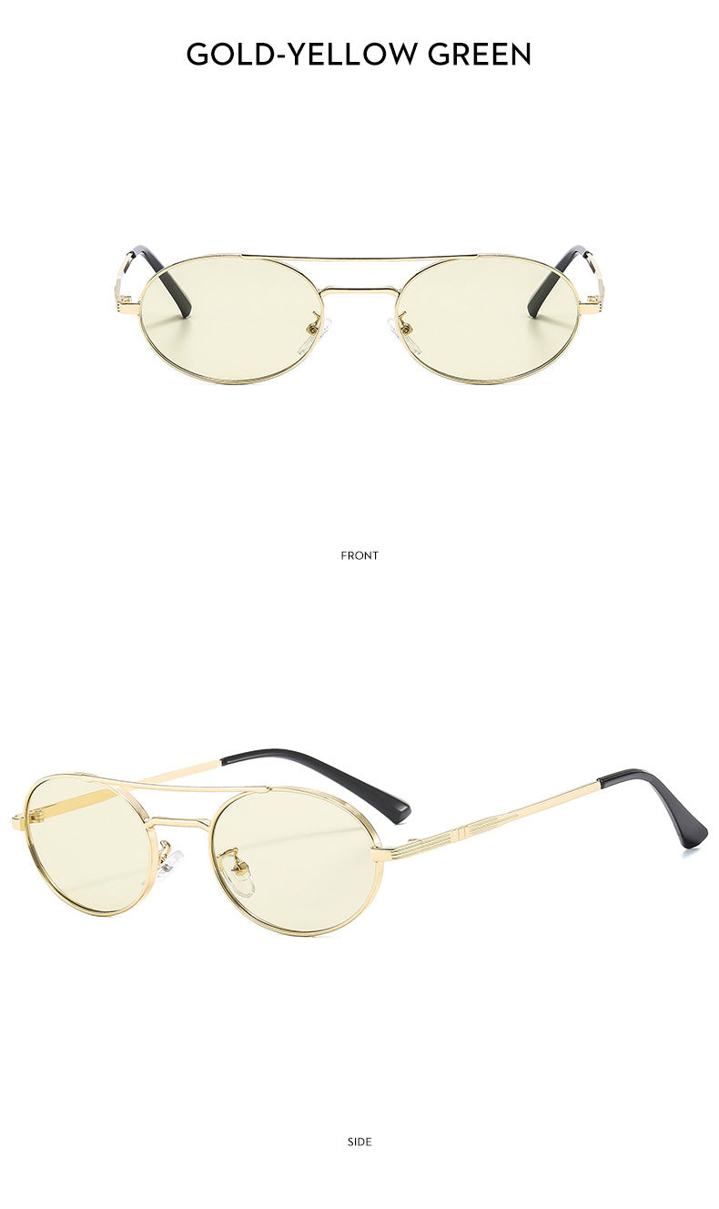 Gold-framed sunglasses with yellow-tinted lenses on a white background
