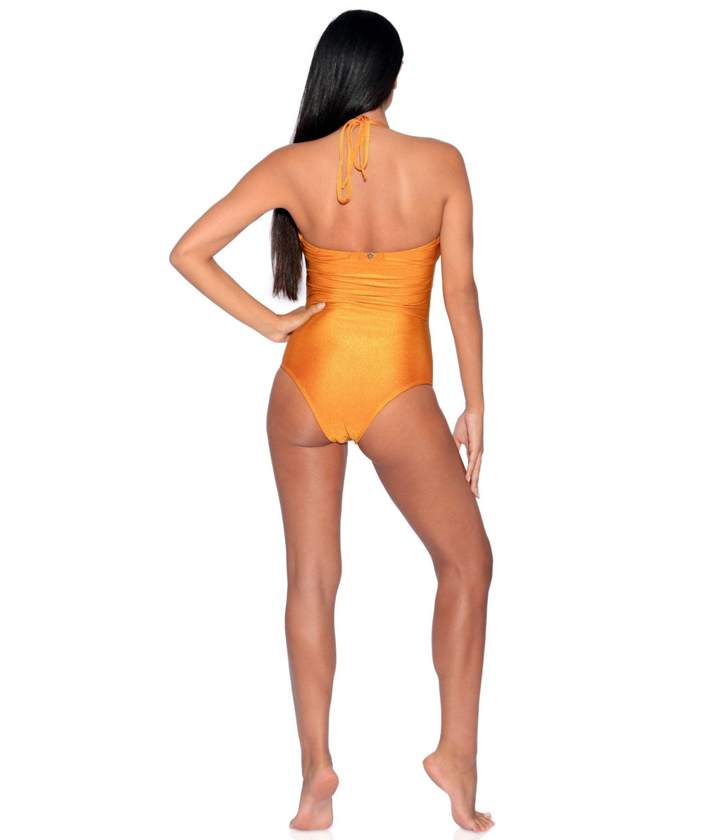 Woman wearing an orange swimsuit on a white background