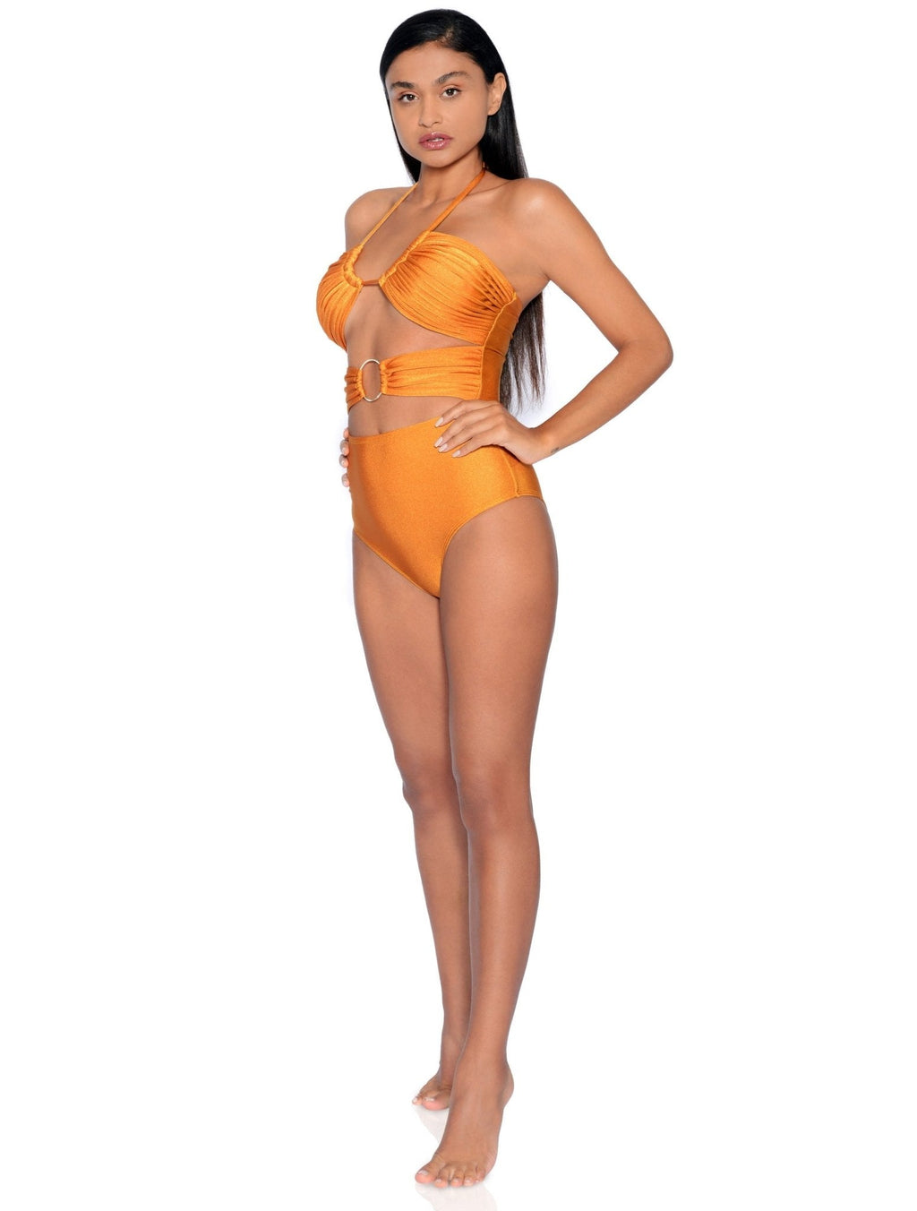 Woman wearing an orange swimsuit on a white background