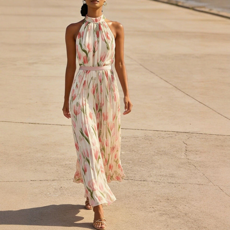 Woman wearing a floral dress walking on a concrete surface.