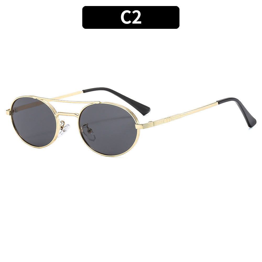 Gold-framed sunglasses with black lenses on a white background