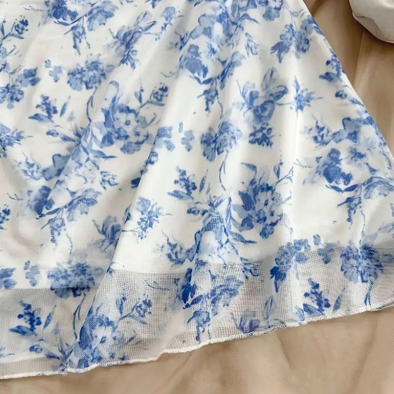 White fabric with blue floral pattern on a wooden surface